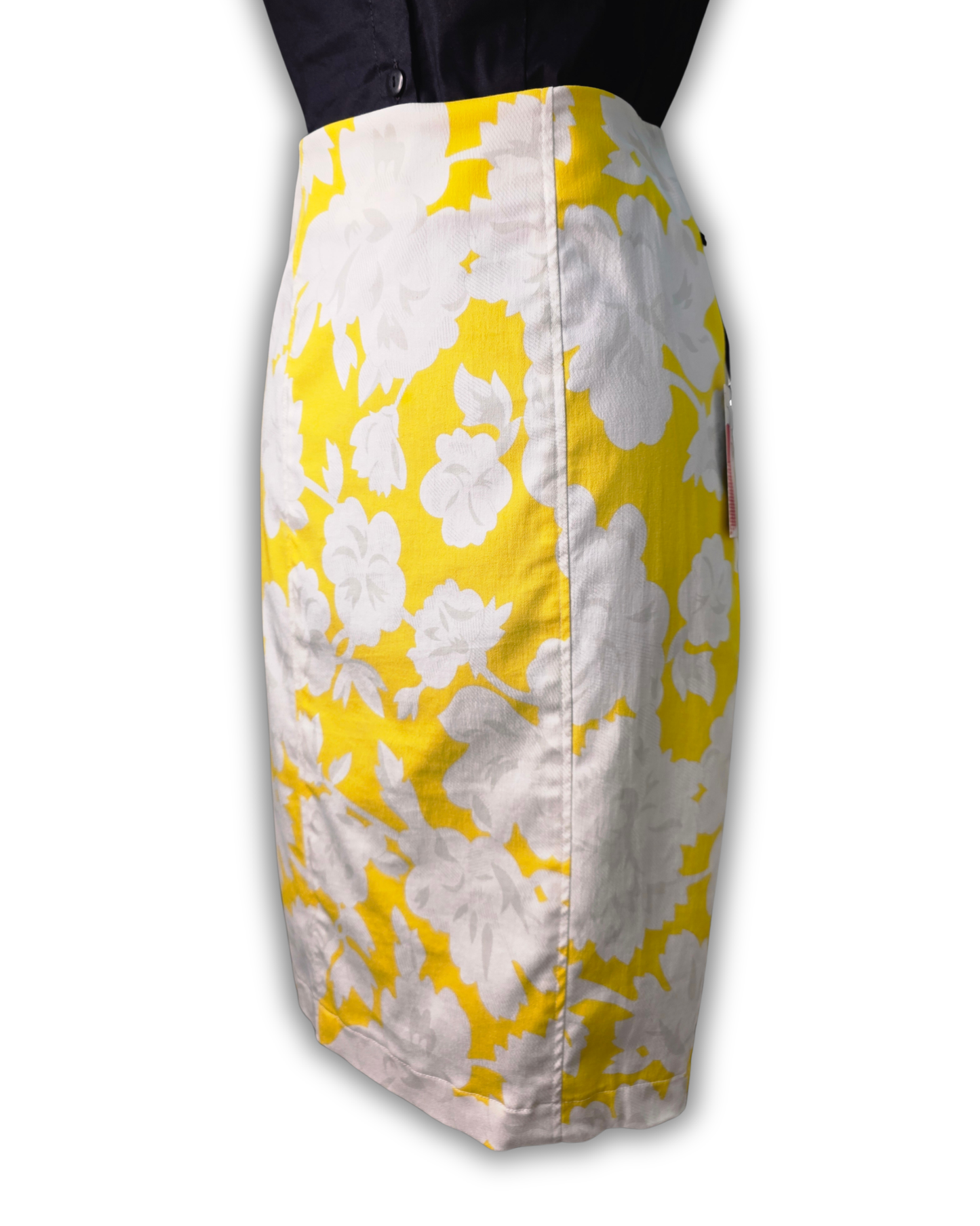 A knee-length pencil skirt with a bold yellow and white floral pattern, shown on a mannequin torso against a plain white background.

Ruby De Vine ladies pencil skirt handmade on the Gold Coast featuring a 1950s-inspired fitted silhouette with back split and rear zip. Now available on Rockabilly Australia.