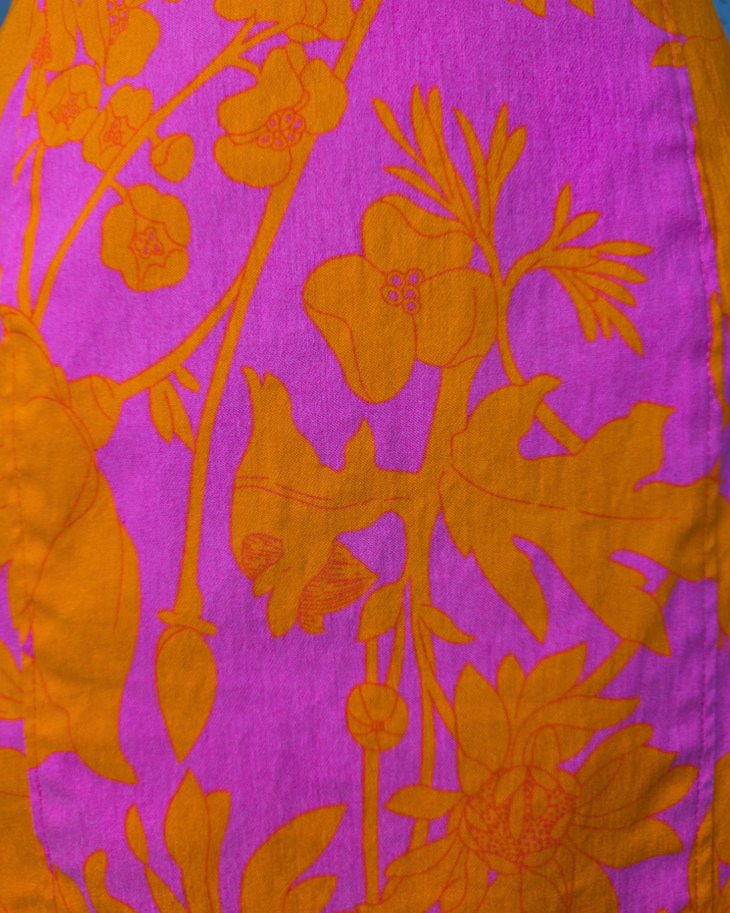A close-up of a fabric pattern featuring a vibrant magenta pink background with a bold orange floral and leafy design

Ruby De Vine ladies pencil skirt handmade on the Gold Coast featuring a 1950s-inspired fitted silhouette with back split and rear zip. Now available on Rockabilly Australia.