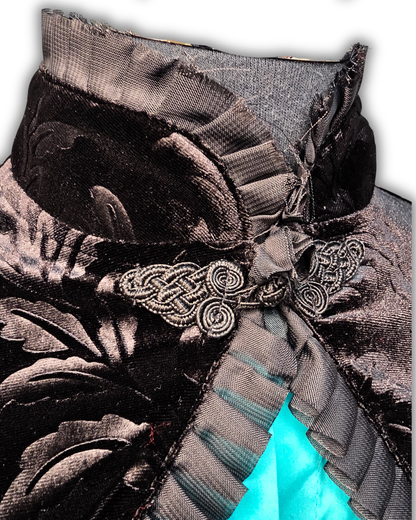 Ruby De Vine Black Velvet Bolero handmade on the Gold Coast featuring a Chinese-style collar, pleated frill trim and traditional frog closure.