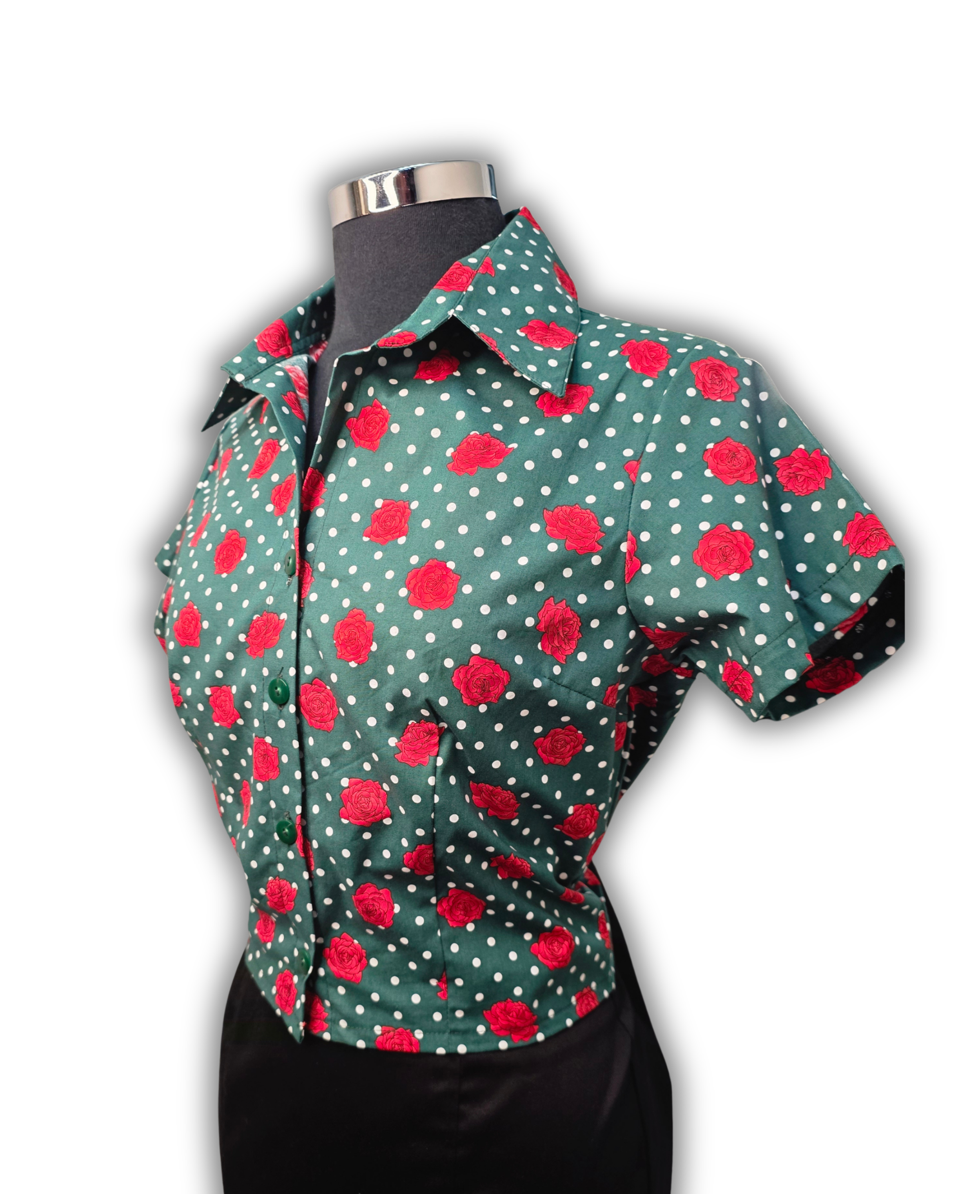 Ruby De Vine ladies blouse handmade on the Gold Coast featuring a slim-fit stretch cotton design with short sleeves and a classic collar in dark green base with white polka dots and red rose pattern