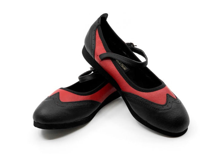 Ladies black & red classic wingtip style rock'n'roll dance flats by My Juju Dance Fever.   Hand crafted with carefully selected genuine leather for upper and inner   Single strap with elastic buckle for a stronger hold and added movement   Elegant, closed-toe wingtip design   Flat cushioned, smooth rubber sole enables you to dance on all surface types!  Super lightweight for fast movements on the dance floor.  Gel innersole for long lasting cushioned support   Stylish & comfortable design with fantastic ver